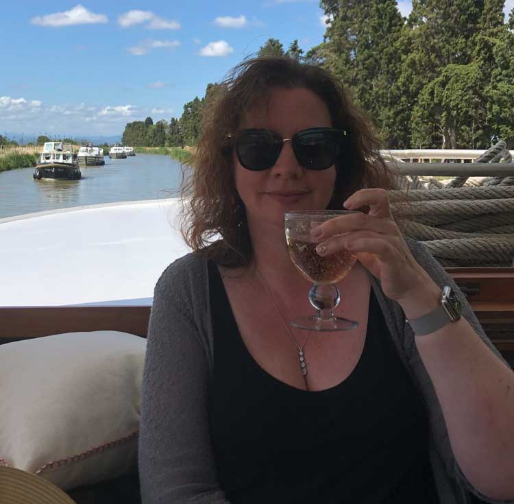 Kate MacIntosh headshot with book cover for The Champagne Letters